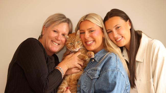 Wasabi the cat reunited was his owner Lisa Prendergast and her daughters Abbey and Karli after being missing for five weeks. Picture: Alison Wynd.