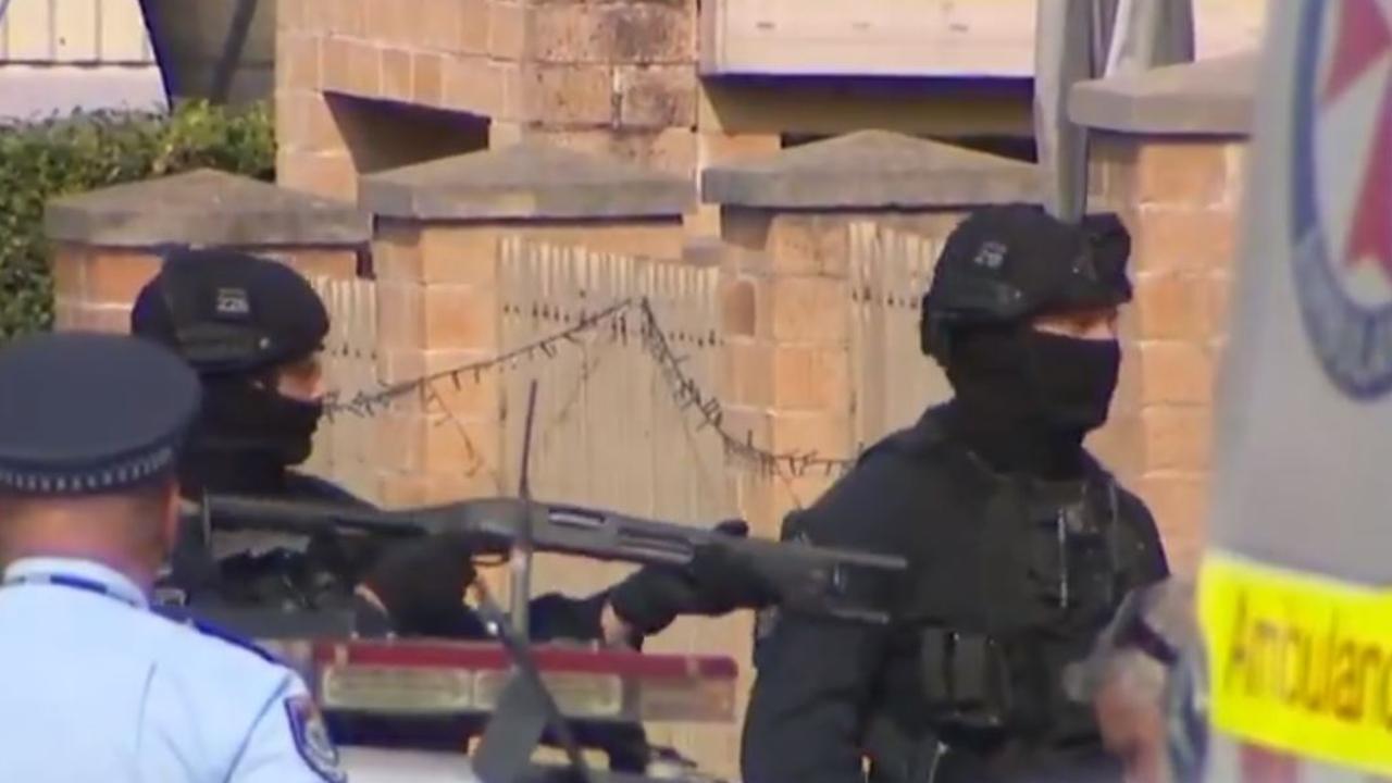 Heavily armed police at the scene. Picture: 7 News