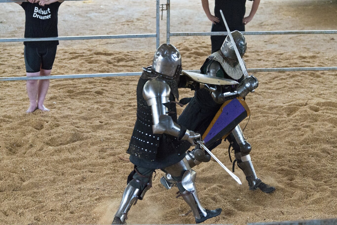 Dave Malloy (left) and Jaxon Harris fight during the Buhurt, Beer and BBQ event.