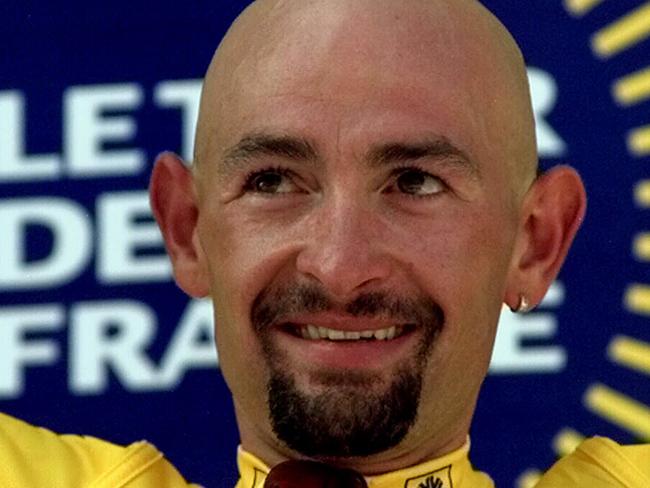 Cycling - Italian cyclist Marco Pantani standing on podium retaining yellow jersey after 18th stage of Tour de France race 30 Jul 1998. p/