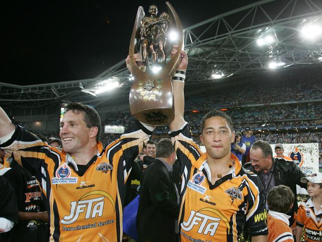 Mark O'Neill and Benji Marshall celebrate with the trophy after winning the 2005 grand final.