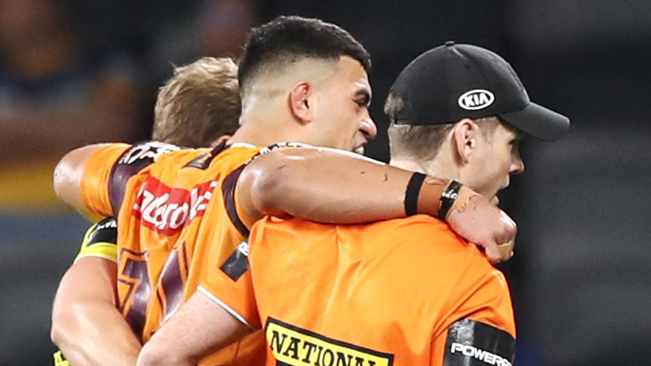 David Fifita of the Broncos is assisted from the field.