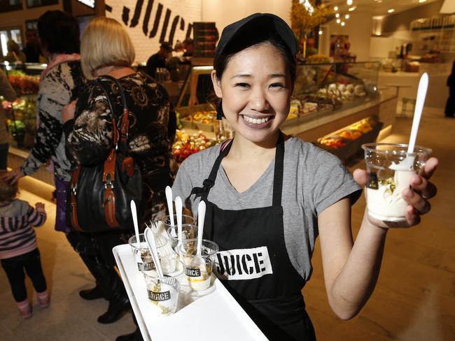 Pictured is Mari Griffin handing out free samples of juice and yoghurt.