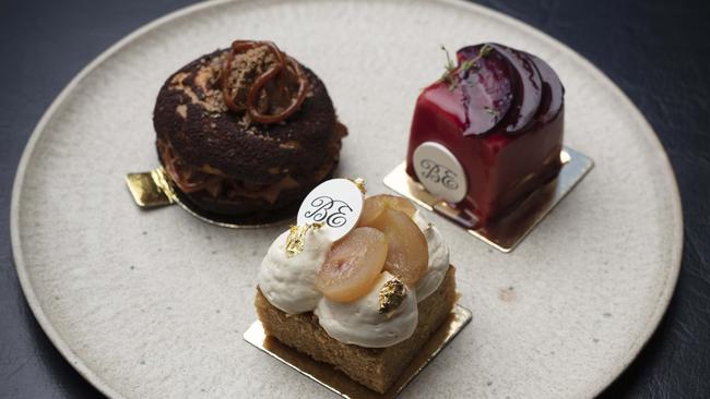 (Clockwise from centre) Pear and ginger cake, coffee and hazelnut Paris-brest and plum and shiso mousse cake. Picture: Russell Shakespeare