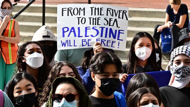 A participant holds a placard as students gather during a "Walkout to fight Genocide and Free Palestine" at Bruin Plaza at UCLA. Picture: AFP