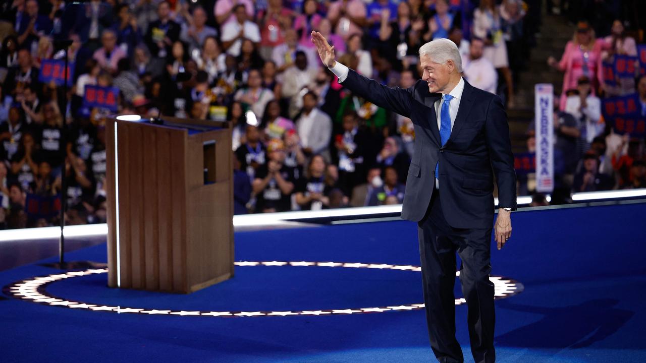 Bill Clinton departs after speaking on stage. Picture: Getty Images via AFP.