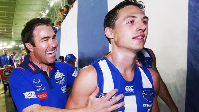 Kangaroos coach Brad Scott hugs Ben Jacobs after their win over Hawthorn last weekend. Picture: Michael Dodge/Getty Images