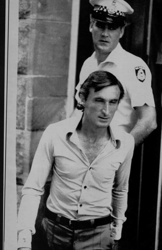 The tiny figure of jockey-sized psychopathic killer, David Birnie, emerges from court after being sentenced to life for serial murder.