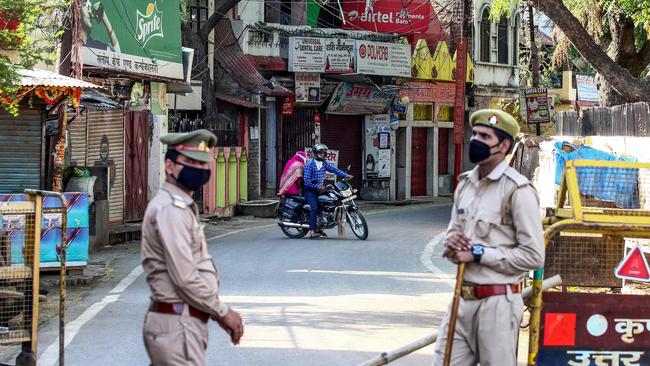 Police block a street after a suspected case for coronavirus has been discovered in the Teliarganj area of India’s Allahabad on Friday. Picture: AP