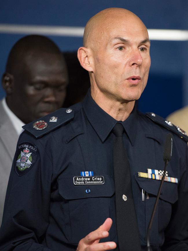 Victorian Deputy Commissioner Andrew Crisp speaks to the media alongside African community leaders. Picture: AAP