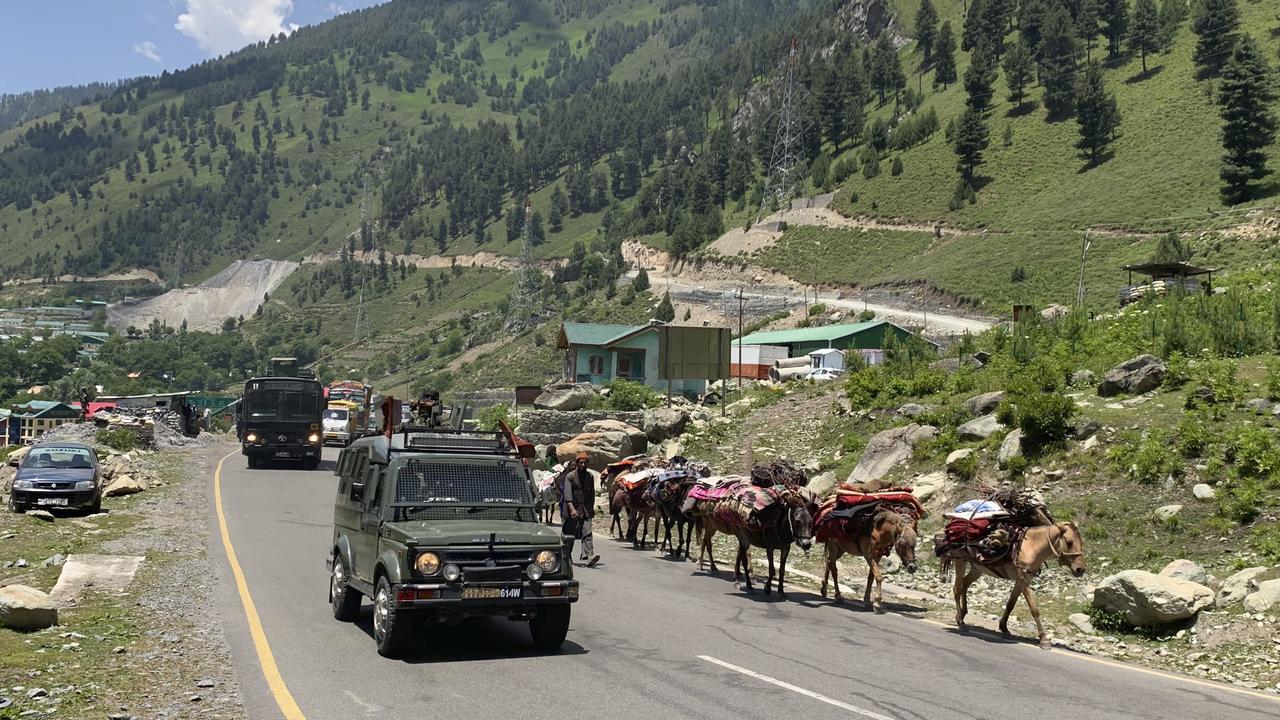 An Indian army convoy moves on the Srinagar-Ladakh highway at Gagangeer, northeast of Srinagar, in Indian-controlled Kashmir. Picture: AP