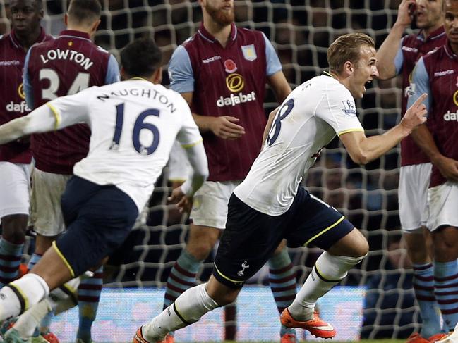 Tottenham Hotspur's English striker Harry Kane (C) celebrates scoring the second goal the English Premier League football match between Aston Villa and Tottenham Hotspur at Villa Park in Birmingham, central England, on November 2, 2014. Tottenham won the match 2-1. AFP PHOTO /ADRIAN DENNIS RESTRICTED TO EDITORIAL USE. No use with unauthorized audio, video, data, fixture lists, club/league logos or “live” services. Online in-match use limited to 45 images, no video emulation. No use in betting, games or single club/league/player publications.