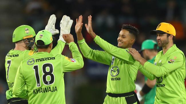 CANBERRA, AUSTRALIA – DECEMBER 29: Tanveer Sangha of the Thunder celebrates after dismissing Hilton Cartwright of the Stars during the Big Bash League match between Sydney Thunder and the Melbourne Stars at Manuka Oval, on December 29, 2020, in Canberra, Australia. (Photo by Mike Owen/Getty Images)