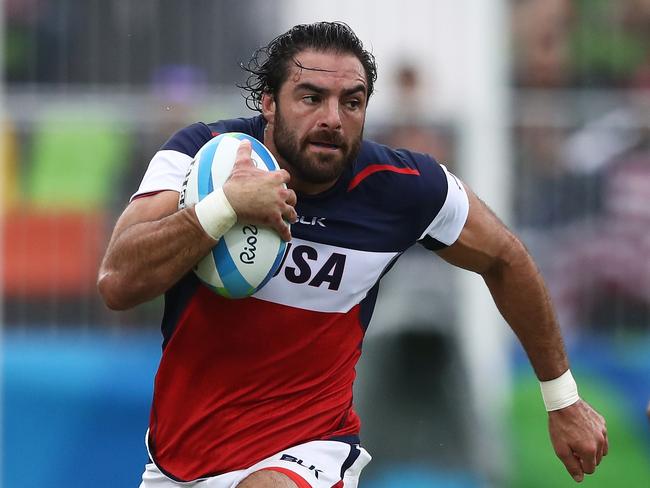 RIO DE JANEIRO, BRAZIL - AUGUST 10: Nate Ebner of the United States on his way to scoring a try during the Men's Pool A, Match 18 Fiji and United States of America on Day 5 of the Rio 2016 Olympic Games at Deodoro Stadium on August 10, 2016 in Rio de Janeiro, Brazil. (Photo by David Rogers/Getty Images)