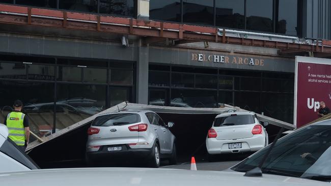 A construction barrier on Moorabool St fell onto parked cars. Pictures: Shaun Viljoen