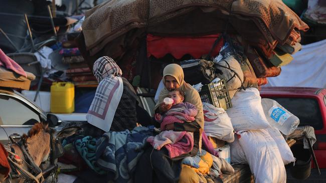 Displaced Palestinians make their way from the south to the northern parts of the Gaza Strip. Picture: Eyad Baba / AFP