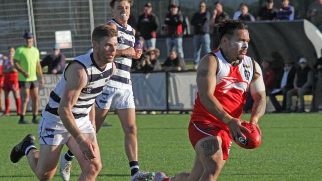 Robinvale-Euston's Isaiah Johnson burns off his South Mildura opponent last year. Picture: Glenn Milne