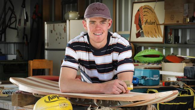 Jez McLennan pictured working on his surfboard in the in the Barossa Valley before Gold Coast selected him at the 2018 national AFL draft. Picture: AAP/Dean Martin