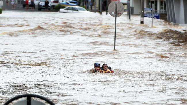 A brave rescuer saves a man in Lismore during the catastrophic floods.