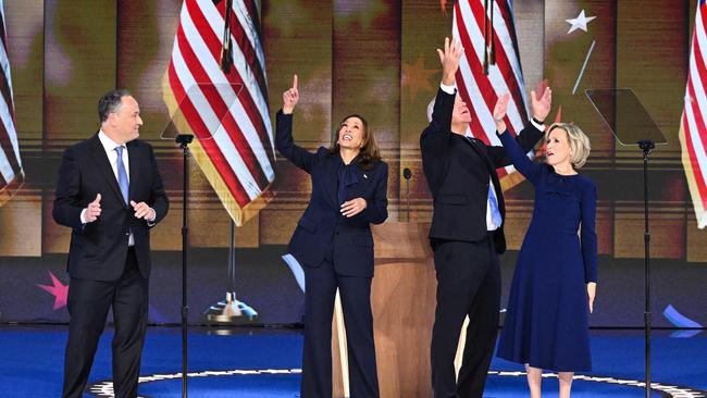 Kamala Harris (2L) stands onstage with Second Gentleman Douglas Emhoff, Tim Walz and Gwen Walz as the convention ends. Picture: AFP.