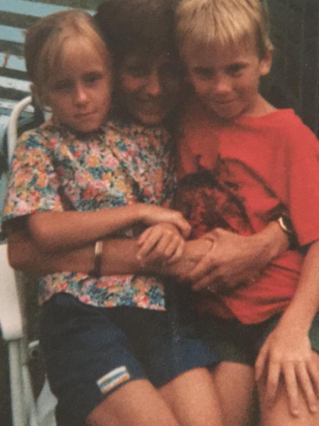 Moran, with twin sister Alison, aged about six, sitting on their mum Trish’s lap. Picture: Supplied