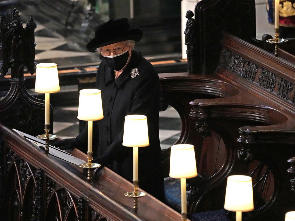 Queen Elizabeth II watches as pallbearers carry the coffin of Prince Philip, Duke Of Edinburgh into St George’s Chapel. Picture: Yui Mok-WPA Pool/Getty Images