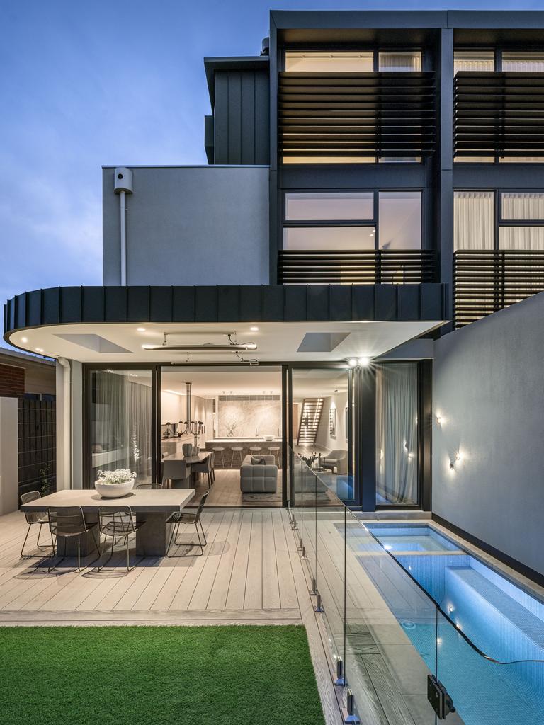 A pool and spa in the back garden.