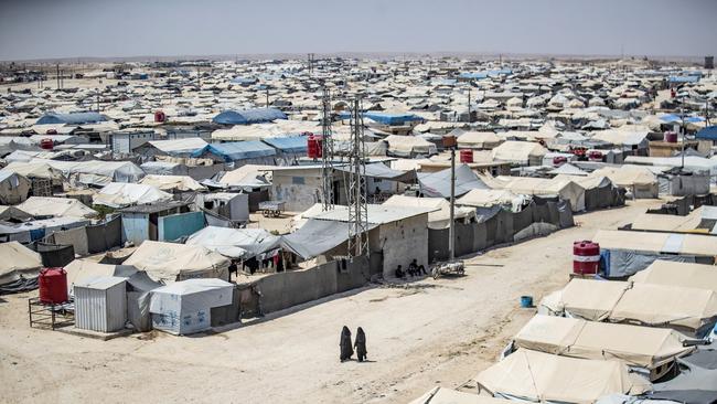 Women walk among shelters at the Kurdish-run al-Hol camp, which holds relatives of suspected Islamic State group fighters in Syria. Picture: Delil Souleiman AFP