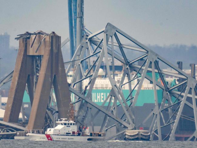 Part of the steel frame of the Francis Scott Key Bridge sits in the waters of the Patapsco River. Picture: AFP