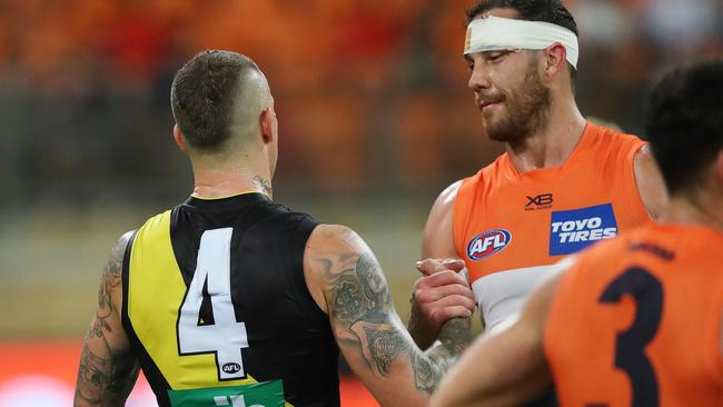 Martin and Shane Mumford shake hands after the siren. Picture. Phil Hillyard