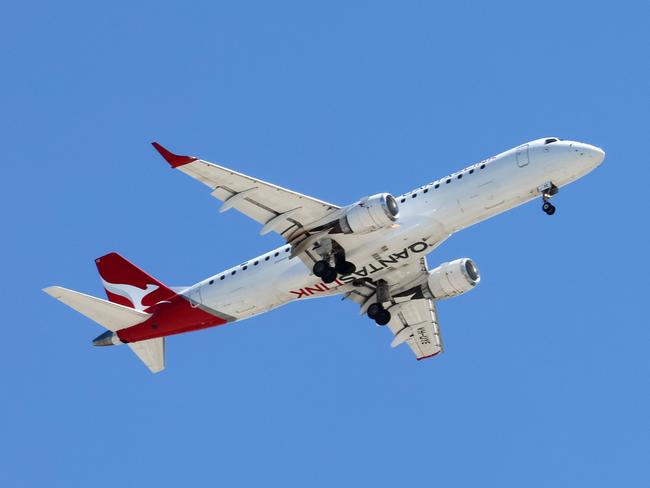 BRISBANE, AUSTRALIA - NewsWire Photos SEPTEMBER 30, 2024: A Qantas plane prepares to land in Brisbane. Hundreds of Qantas workers went on strike today demanding higher wages. Picture: NewsWire/Tertius Pickard