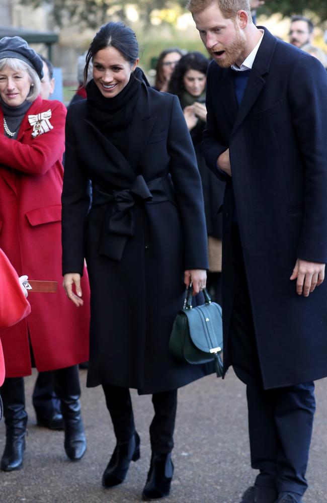 Prince Harry and his fiancée Meghan Markle meet up with children as they arrive to a walkabout at Cardiff Castle on January 18, 2018 in Cardiff, Wales. Picture: Getty