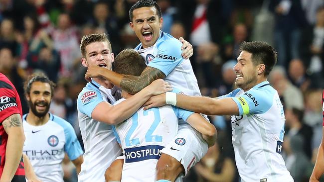 Tim Cahill celebrates Michael Jakobsen’s stunning overhead goal.