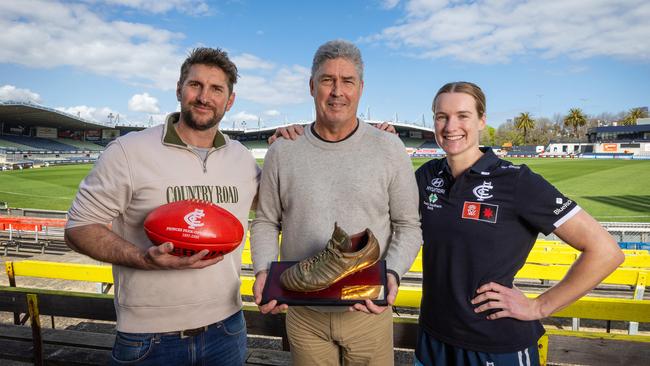 Jarrad Waite with the match ball from the final AFL game at Ikon Park in 2005, along with Stephen Kernahan with the bronzed boot from his 200th match at the venue in 1996. AFLW star Breann Moody will play in the 1000th competitive Carlton game at the Princes Park venue on Saturday night. Picture: Mark Stewart