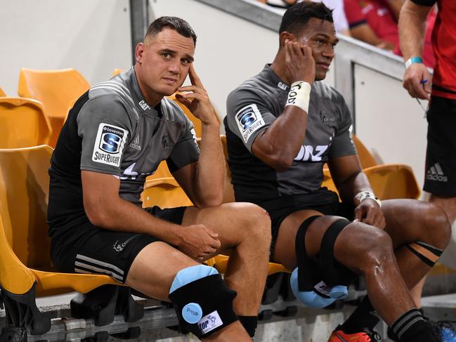 Crusaders player Israel Dagg (left) sits injured on the bench during the 3rd round Super Rugby match between the Queensland Reds and the Canterbury Crusaders at Suncorp Stadium in Brisbane, Saturday, Mar. 11, 2017. (AAP Image/Dave Hunt) NO ARCHIVING, EDITORIAL USE ONLY