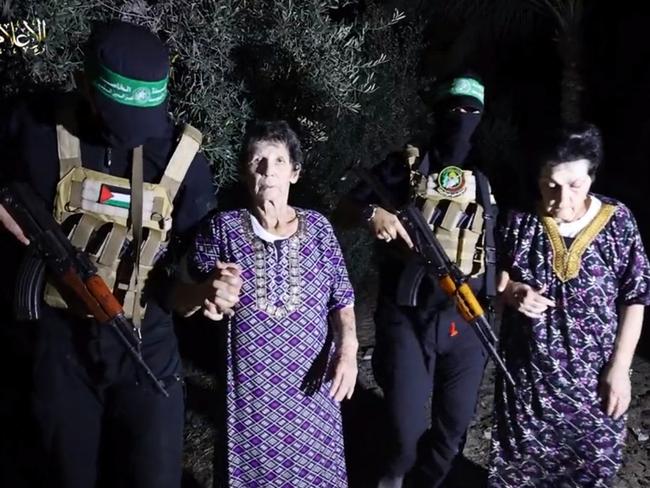 Yocheved Lifshitz and Nurit Cooper (also known as Nurit Yitzhak) who were held hostages by Palestinian Hamas militants, are released by the militants, in this video screengrab. Source: Twitter