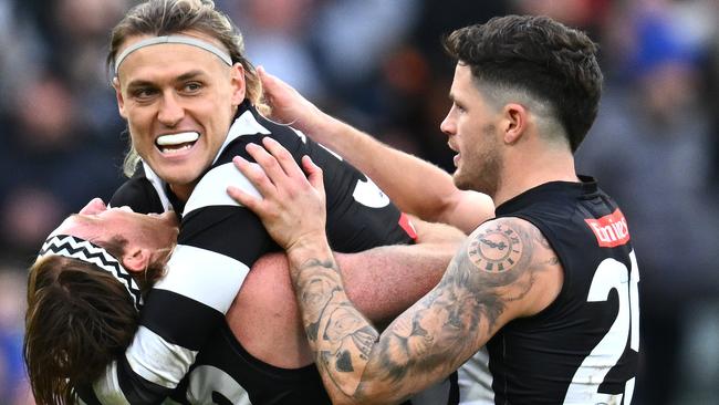 *APAC Sports Pictures of the Week - 2023, June 26* - MELBOURNE, AUSTRALIA - JUNE 25: Darcy Moore, Nathan Murphy and Jack Crisp of the Magpies celebrate winning the round 15 AFL match between Collingwood Magpies and Adelaide Crows at Melbourne Cricket Ground, on June 25, 2023, in Melbourne, Australia. (Photo by Quinn Rooney/Getty Images)