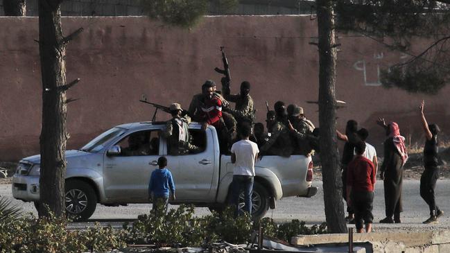 Turkish-backed Syrian opposition fighters in Tal Abyad, Syria. Picture: AP.