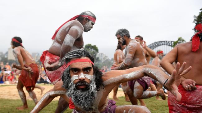 Koomurri people and representatives of aboriginal groups from around Australia perform the Smoking Ceremony and Dance during the WugulOra Morning Ceremony.