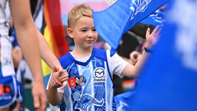 HOBART, AUSTRALIA - OCTOBER 13: Team mascot takes the field with the players during the round seven AFLW match between North Melbourne Kangaroos and Sydney Swans at North Hobart Oval, on October 13, 2024, in Hobart, Australia. (Photo by Steve Bell/AFL Photos/via Getty Images)