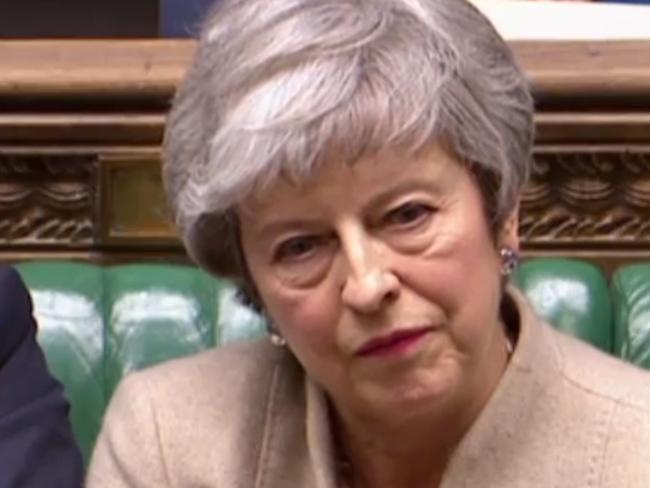 A video grab from footage broadcast by the UK Parliament's Parliamentary Recording Unit (PRU) shows Britain's Prime Minister Theresa May reacting as Labour Party leader Jeremy Corbyn speaks on a point of order in the House of Commons in London on March 29, 2019 after MPs rejected her EU Withdrawl deal for a third time. - MPs voted to reject for a third time Prime Minister Theresa May's Brexit divorce deal by 58 votes. (Photo by - / PRU / AFP) / RESTRICTED TO EDITORIAL USE - MANDATORY CREDIT " AFP PHOTO / PRU " - NO USE FOR ENTERTAINMENT, SATIRICAL, MARKETING OR ADVERTISING CAMPAIGNS - EDITORS NOTE THE IMAGE HAS BEEN DIGITALLY ALTERED AT SOURCE TO OBSCURE VISIBLE DOCUMENTS