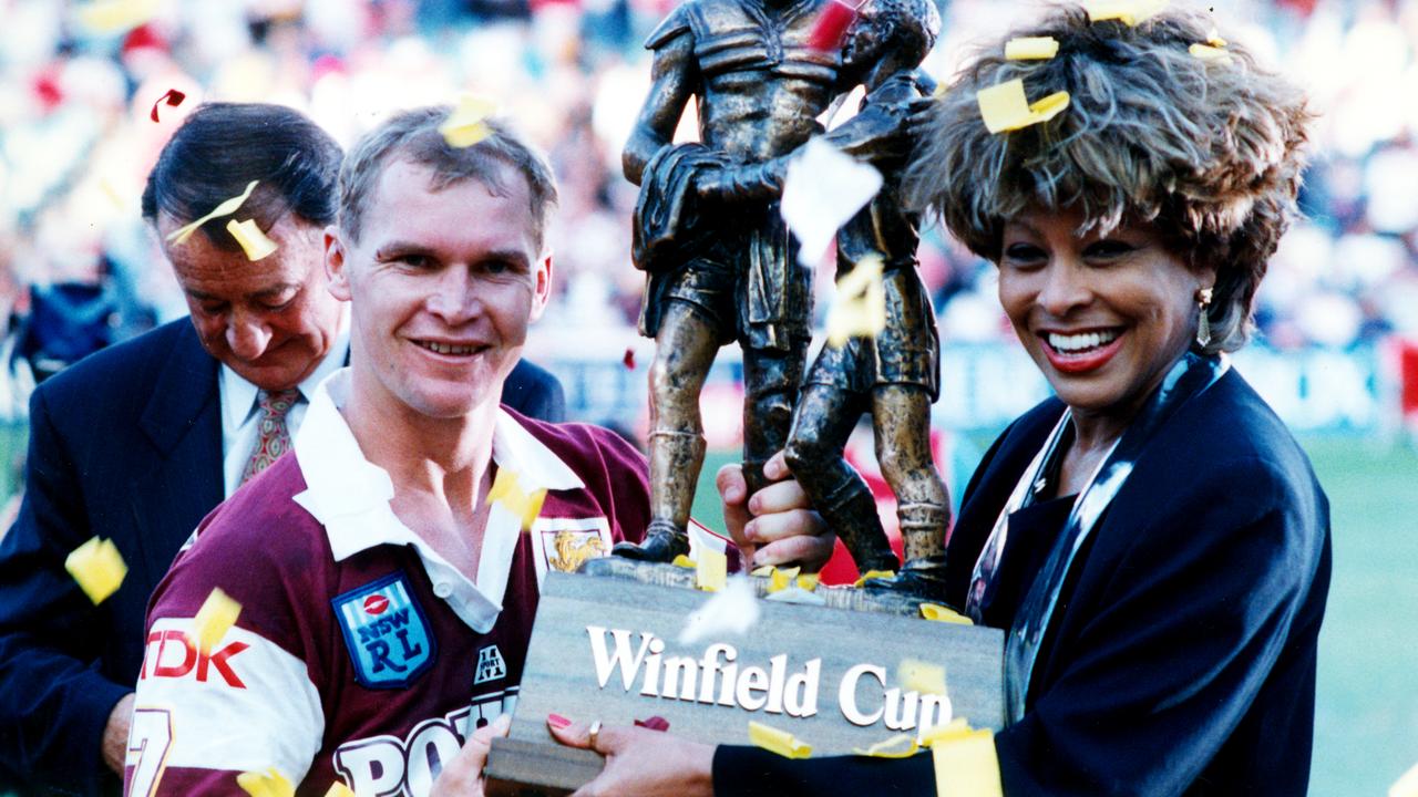 Alfie Langer and Tina Turner hold the Winfield Cup after the 1993 Grand Final.