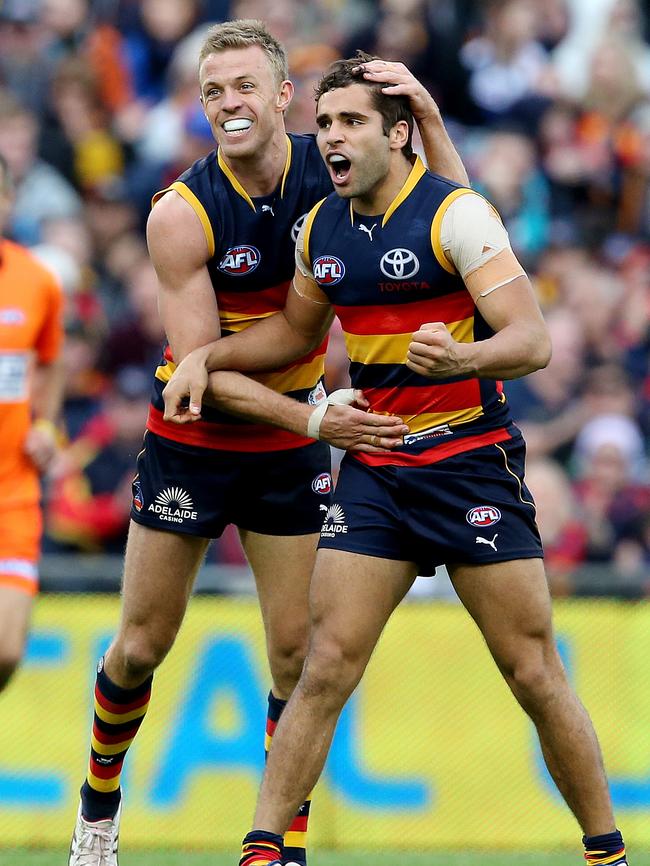 Jared Petrenko celebrates a Showdown goal with Nathan van Berlo during his Crows career. Picture: SARAH REED