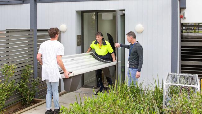 Investigators raid a Croydon property suspected of running an illegal solarium. Picture: Mark Stewart