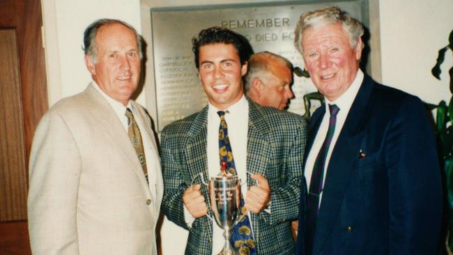 Josh Frydenberg is flanked by tennis greats Neale Fraser (left) and Frank Sedgman after he won the Pat Cash Cup as a young player. 