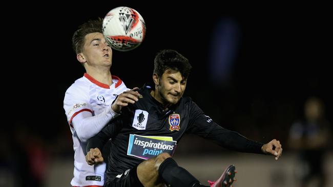 Will Bower gets the better of the Jets’ John Koutroumbis.