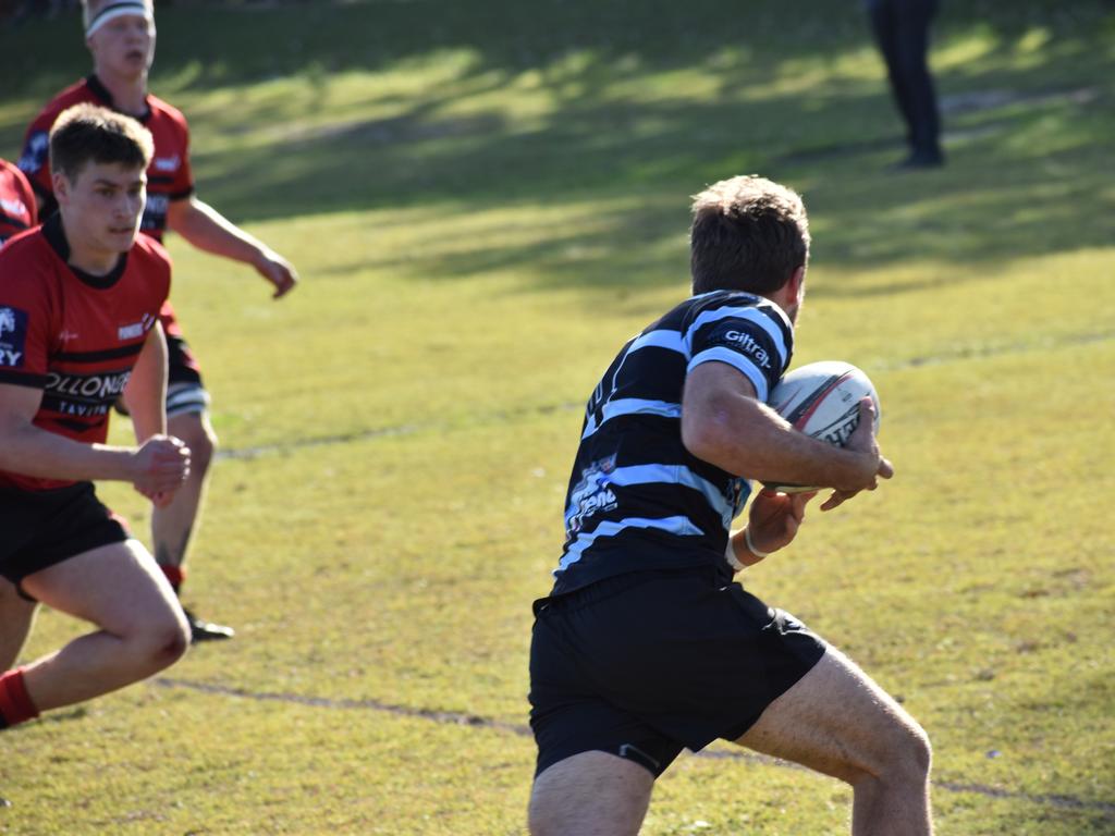 Joel Noble breaks away towards the try line for Ballina