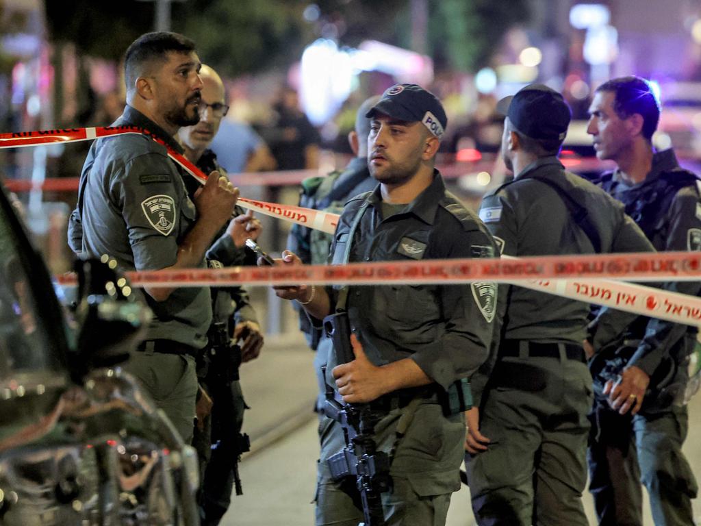 Israeli border guards are seen at the scene of the shooting attack. Picture: Jack GUEZ / AFP