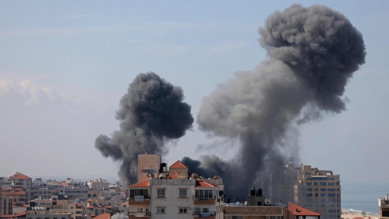 Smoke billows from a residential building following an Israeli air strike in Gaza City on October 7. Picture: Mohammed Abed / AFP