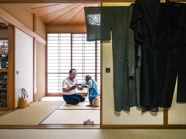 Kaoru Amagai may live in a traditional Japanese home, but his lifestyle is far from traditional. He shares his home with three macaques. Kin is the oldest of the monkeys and Mr. Amagai cares for them as he would any child, helping them dress, bathe, or finish their daily yoghurt snack. Picture: Jasper Doest/World Press Photo